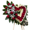 Medium red rose heart, bouquet of white lilies next to it, baby breath with lemon leaf around it