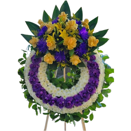 Crown with purple rose around it, and bouquet with yellow rose, yellow lily, purple spider, solidago and lemon leaf around it