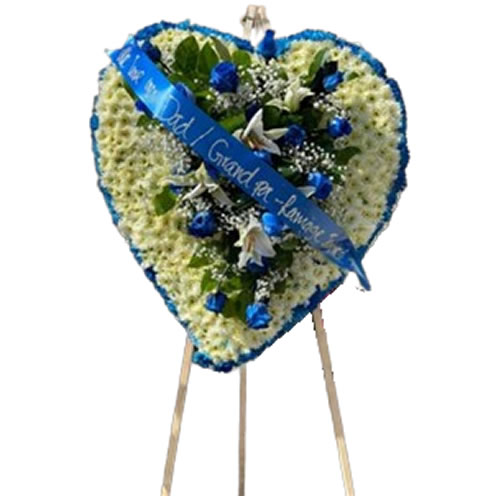 Large heart filled with a bouquet of blue roses and white lilies with a blue border